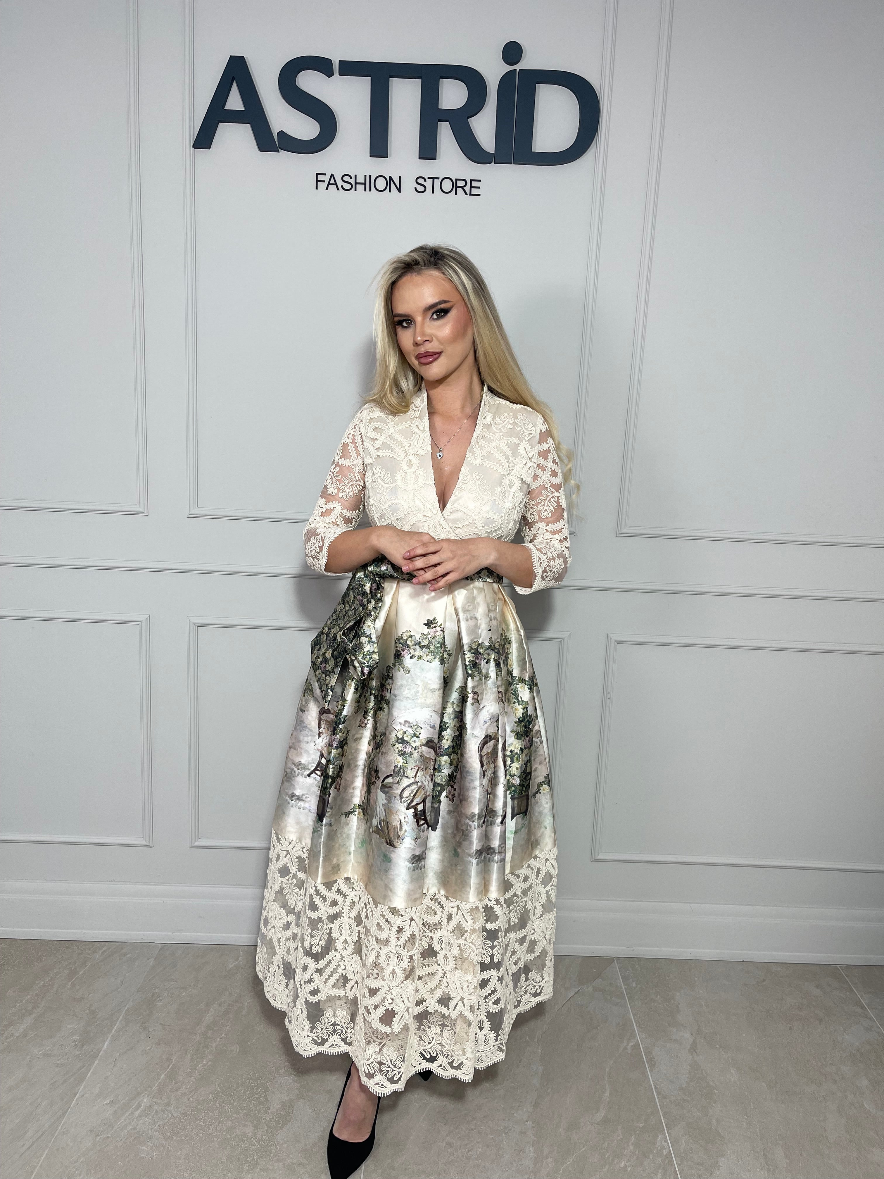 Rochie Mira midi elegantă, cu imprimeu tip dantelă și croiala feminină, ce evidențiază silueta.